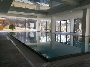 a large building with a glass floor and windows at Schluchseestube 3309 in Schluchsee
