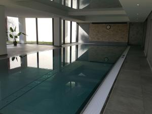 an empty swimming pool in a building at Schluchseestube 3309 in Schluchsee +19 photos