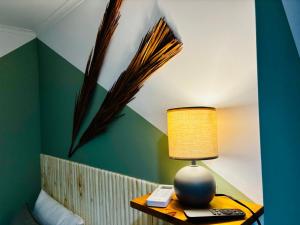 a lamp on a table in a room at Cine Studios PT in Setúbal