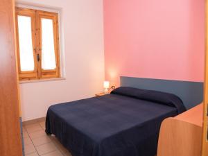 Posteľ alebo postele v izbe v ubytovaní Apartment in Vieste, a drive away from the sea