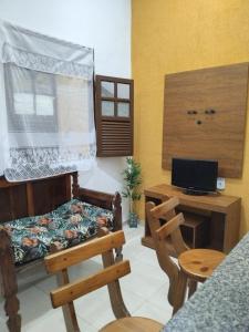 TV a/nebo společenská místnost v ubytování Casa Aconchego em Lençóis