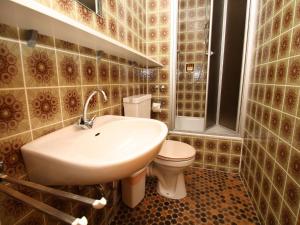 a bathroom with a sink and a toilet at Apartments in Wieda in Wieda +37 photos