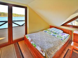 Φωτογραφία από το άλμπουμ του Holiday Home by Lake Rosnowskie with Boat, cleaning included σε Rosnowo