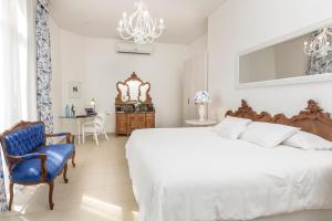 Cama ou camas em um quarto em La Mision Hotel Boutique