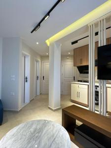 a large room with a kitchen with a table at Porto Matrouh in Marsa Matruh