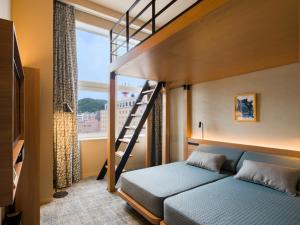 GRIDS PREMIUM HOTEL OTARU客房内的一张或多张床位