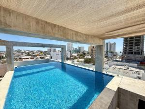 a swimming pool on the roof of a building at Loft a few blocks from the beach in Mazatlán