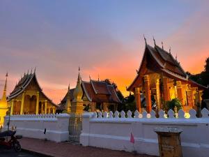 a building with a fence in front at Onson De Boutique Hotel in Luang Prabang