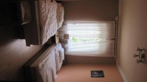 Postel nebo postele na pokoji v ubytování Alsóhegyi Apartmanok