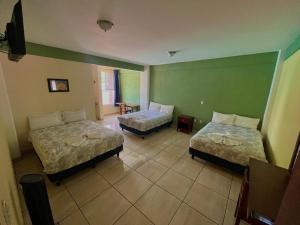 Postel nebo postele na pokoji v ubytování Hotel Casa Rus