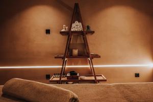a shelf in the corner of a room at Sagredo Boutique Hotel & Spa in Ágios Fokás