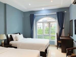 Postel nebo postele na pokoji v ubytování La Serena Hotel & Apartment