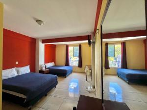 Postel nebo postele na pokoji v ubytování Hotel Casa Rus