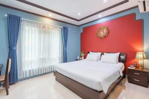 Postel nebo postele na pokoji v ubytování La Serena Hotel & Apartment