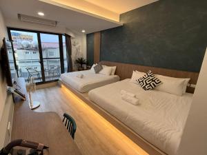 Postel nebo postele na pokoji v ubytování 柔意琉居 Zoy Liuqiu Inn + 37 fotografií