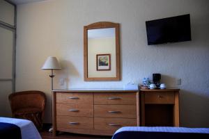Postel nebo postele na pokoji v ubytování Hotel Calli