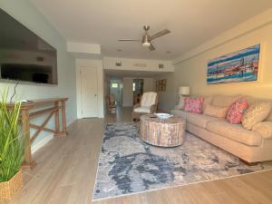 a living room with a couch and a table at B5 Little Bay Landing Long Term in Rockport