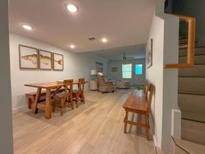 a dining room and living room with a table and chairs at B5 Little Bay Landing Long Term in Rockport