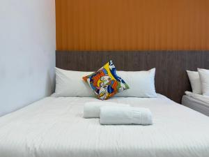 Postel nebo postele na pokoji v ubytování 柔意琉居 Zoy Liuqiu Inn