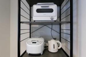 a shelf with a toaster and a printer on it at GaiarS8 in Sapporo +53 photos