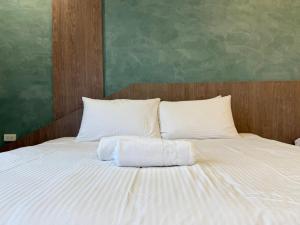 Postel nebo postele na pokoji v ubytování 柔意琉居 Zoy Liuqiu Inn