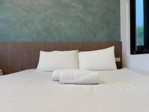 Postel nebo postele na pokoji v ubytování 柔意琉居 Zoy Liuqiu Inn