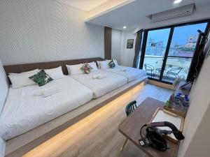 Postel nebo postele na pokoji v ubytování 柔意琉居 Zoy Liuqiu Inn