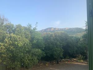 a view of the mountains from the door of a house at U FARNIENTE in Patrimonio