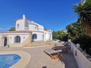 a villa with a swimming pool and a resort at Vinolga in Benitachell