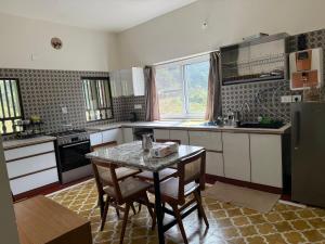 Kuchyň nebo kuchyňský kout v ubytování Estate Stay + 32 fotografií