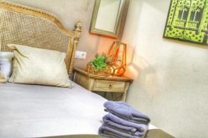 Postel nebo postele na pokoji v ubytování Apartamentos Alcazar de Baeza