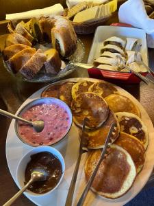 a table with a bunch of different types of bread at Penzion Pod Hradem in Nové Hrady +54 photos