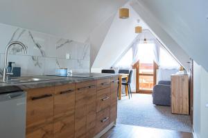a kitchen with a sink and a counter top at Noclegi Olszówka in Bukowina Tatrzańska