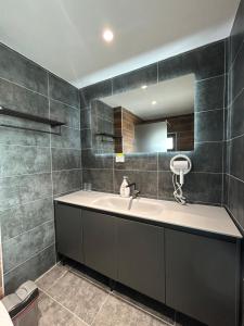 a bathroom with a sink and a mirror at miami costinesti in Costinesti