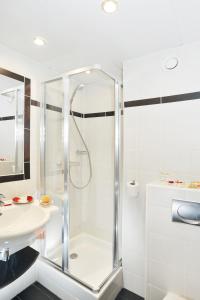 a bathroom with a shower and a sink at Carladez Cambronne in Paris +39 photos