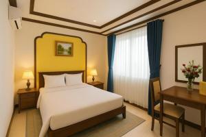 Postel nebo postele na pokoji v ubytování La Serena Hotel & Apartment