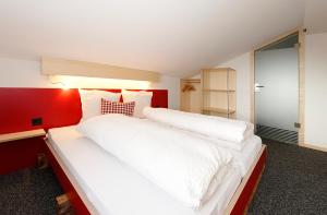 Postel nebo postele na pokoji v ubytování Alpinhotel Bort