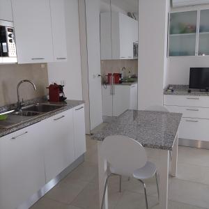 Η κουζίνα ή μικρή κουζίνα στο Seaside Apartment