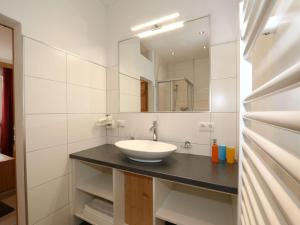 A bathroom at Apartment building, Fügen