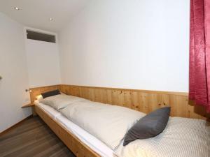 A bed or beds in a room at Apartment building, Fügen