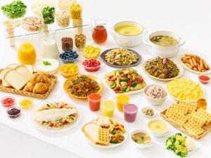 a table filled with different types of food at Comfort Hotel Tokyo Kanda in Tokyo