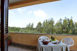 Balcone o terrazza di Bed and breakfast Le Camelie