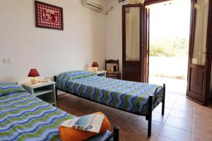 Letto o letti in una camera di Bed and breakfast Le Camelie