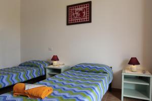 Letto o letti in una camera di Bed and breakfast Le Camelie