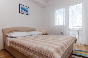 Postel nebo postele na pokoji v ubytování Villa Levanda