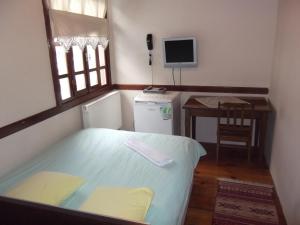 En eller flere senge i et værelse på Guney Konak