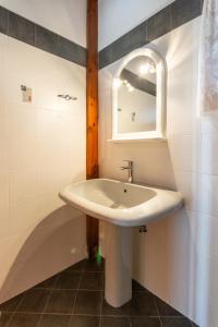 a bathroom with a sink and a mirror at Kondylis Cottage in Provatas +20 photos