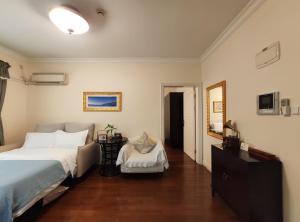 Postel nebo postele na pokoji v ubytování Ladoll Service Apartments