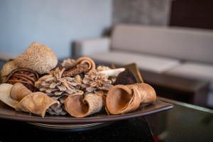 a plate of different types of mushrooms on a table at Hotel Mediterraneo in Cavi di Lavagna