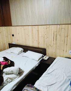 Postel nebo postele na pokoji v ubytování Hotel Dwarikesh Badrinath